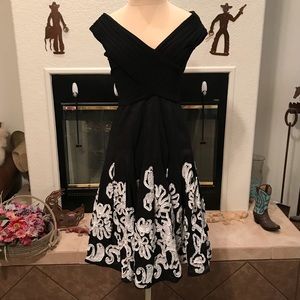 Off the shoulder black with white floral dress.